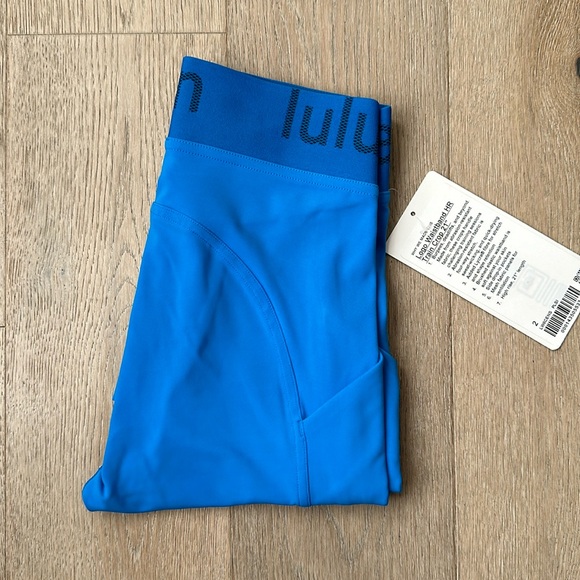Logo waist band high rise training crop 21” poolside size...